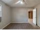 Bedroom featuring ceiling fan and an adjacent room at 3637 Windmill Rd, Ellenwood, GA 30294
