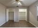 Bedroom with walk-in closets and ceiling fan at 3637 Windmill Rd, Ellenwood, GA 30294