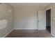 Bedroom with neutral walls, carpet, and a doorway leading to another room at 3637 Windmill Rd, Ellenwood, GA 30294