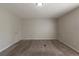 Spacious carpeted bedroom with neutral walls and ample natural light at 3637 Windmill Rd, Ellenwood, GA 30294