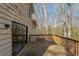 Wooden deck with railings and sliding glass door access to the home at 3637 Windmill Rd, Ellenwood, GA 30294