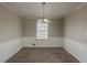 Cozy dining room with overhead lighting and carpet flooring, perfect for Gathering meals at 3637 Windmill Rd, Ellenwood, GA 30294
