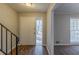 Inviting entryway with hardwood floors, leading to a carpeted living space with ample natural light at 3637 Windmill Rd, Ellenwood, GA 30294