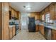 Functional kitchen with wood cabinets, stainless steel appliances, and ample counter space at 3637 Windmill Rd, Ellenwood, GA 30294