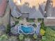 Aerial view of backyard with custom pool, spa and patio, with a lush lawn and mature trees for privacy at 4916 Locklear Way, Marietta, GA 30066