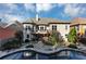 Gorgeous backyard featuring a sparkling pool, a stone patio, and an upper-level deck with outdoor seating at 4916 Locklear Way, Marietta, GA 30066