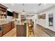 Finished basement with bar, bar stool seating, custom cabinets, stainless steel dishwasher, and wood-look flooring at 4916 Locklear Way, Marietta, GA 30066
