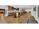 Finished basement with bar, custom cabinets, ample seating, and wood-look flooring at 4916 Locklear Way, Marietta, GA 30066