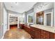 The bathroom offers double sinks, a walk-in shower, and a view into the main bedroom at 4916 Locklear Way, Marietta, GA 30066