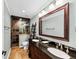 Bathroom featuring a double vanity, large mirror and a tiled standing shower at 4916 Locklear Way, Marietta, GA 30066