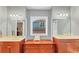 The bathroom features double sinks, mirrors, and a built-in vanity with storage at 4916 Locklear Way, Marietta, GA 30066