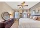 Comfortable bedroom with a dark wood dresser, cozy lighting, and serene decor at 4916 Locklear Way, Marietta, GA 30066
