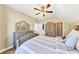 Bedroom featuring neutral tones, nice furniture, ceiling fan, and connecting bathroom at 4916 Locklear Way, Marietta, GA 30066