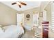 Inviting bedroom features a neutral color palette, ceiling fan, and view to the bathroom at 4916 Locklear Way, Marietta, GA 30066