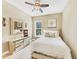 Cozy bedroom with a ceiling fan, neutral walls, and a dresser with decorative mirror at 4916 Locklear Way, Marietta, GA 30066