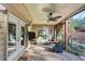 Relaxing covered patio with comfortable seating, ceiling fan, and views of the beautifully landscaped backyard at 4916 Locklear Way, Marietta, GA 30066