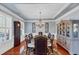 Formal dining room with elegant chandelier, tray ceiling, and classic decor at 4916 Locklear Way, Marietta, GA 30066