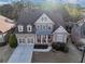 Charming two-story brick home with a well-manicured front yard, a two car garage, and a cozy front porch at 4916 Locklear Way, Marietta, GA 30066