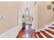 Staircase view with hardwood floors, tall ceilings, and decorative wainscoting at 4916 Locklear Way, Marietta, GA 30066