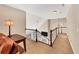 Upstairs hallway features a dark brown wooden handrail and nice lighting fixtures at 4916 Locklear Way, Marietta, GA 30066