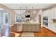 Kitchen with center island and open floor plan flowing to living room at 4916 Locklear Way, Marietta, GA 30066