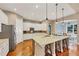 Bright kitchen with white cabinets, a granite island, and stainless steel appliances at 4916 Locklear Way, Marietta, GA 30066
