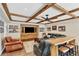 Finished basement living room with exposed beams, couches, shelving, TV, and wood-look floors at 4916 Locklear Way, Marietta, GA 30066