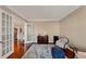 Open office featuring french doors with light hardwood floors at 4916 Locklear Way, Marietta, GA 30066