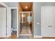 Tiled walk-in shower features glass doors, a built-in bench, and a showerhead at 4916 Locklear Way, Marietta, GA 30066