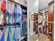 This walk-in closet includes custom shelves and clothing racks for optimized storage at 4916 Locklear Way, Marietta, GA 30066