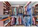 Organized walk-in closet features built-in shelving for shoes, clothes, and accessories at 4916 Locklear Way, Marietta, GA 30066