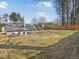 Large backyard with a view of other houses at 5180 Sterling Trace Nw Ct, Lilburn, GA 30047