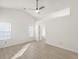 Bright bedroom with vaulted ceiling, neutral paint, and light wood floors at 5180 Sterling Trace Nw Ct, Lilburn, GA 30047