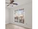 Bright bedroom with hardwood floors, a ceiling fan, and a window with blinds at 5180 Sterling Trace Nw Ct, Lilburn, GA 30047