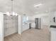 Spacious white kitchen featuring modern appliances, pantry, and open layout at 5180 Sterling Trace Nw Ct, Lilburn, GA 30047