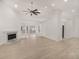 Spacious living room with fireplace and large windows, freshly painted and naturally lit at 5180 Sterling Trace Nw Ct, Lilburn, GA 30047