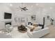 Bright living room boasts high ceilings, fireplace, modern furnishings, and ample natural light at 5180 Sterling Trace Nw Ct, Lilburn, GA 30047