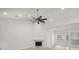 Bright living room showcasing high ceilings, a ceiling fan, and a marble fireplace at 5180 Sterling Trace Nw Ct, Lilburn, GA 30047
