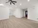 Open-concept living room featuring wood flooring and a front door with glass detailing at 5180 Sterling Trace Nw Ct, Lilburn, GA 30047
