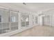 Spacious, well-lit living room with large windows, and modern finishes at 5180 Sterling Trace Nw Ct, Lilburn, GA 30047