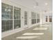 A sun room with windows and doors that allow natural light to fill the space at 5180 Sterling Trace Nw Ct, Lilburn, GA 30047
