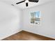 This bedroom offers hardwood floors, fresh white paint and a window with natural light at 6660 Hidden Brook Trl, Atlanta, GA 30349
