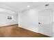 Spacious bedroom features hardwood floors, fresh white paint, and modern paneled doors at 6660 Hidden Brook Trl, Atlanta, GA 30349