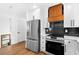 Updated kitchen with stainless steel appliances, quartz countertops, and modern cabinetry at 6660 Hidden Brook Trl, Atlanta, GA 30349