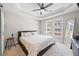 Bright bedroom features a tray ceiling, ceiling fan, and a large window offering plenty of natural light at 2113 Gorman Se Grv, Atlanta, GA 30316