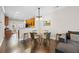 Open-concept dining area with a modern table set, flowing into the kitchen and living spaces at 2113 Gorman Se Grv, Atlanta, GA 30316