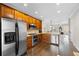 Modern kitchen featuring stainless steel appliances, wooden cabinets, and granite countertops at 2113 Gorman Se Grv, Atlanta, GA 30316
