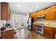 Well-equipped kitchen with stainless steel appliances, wooden cabinets, and granite countertops at 2113 Gorman Se Grv, Atlanta, GA 30316
