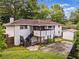 View of the backyard featuring a screened porch with stairs and a storage shed at 215 Collum Nw St, Atlanta, GA 30314