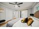 Comfortable bedroom with ceiling fan, hardwood floors, closet, and neutral paint at 215 Collum Nw St, Atlanta, GA 30314